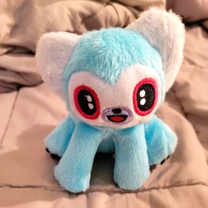 Barkbox dog toy animal with squeaky. Turquoise with black and white tail.